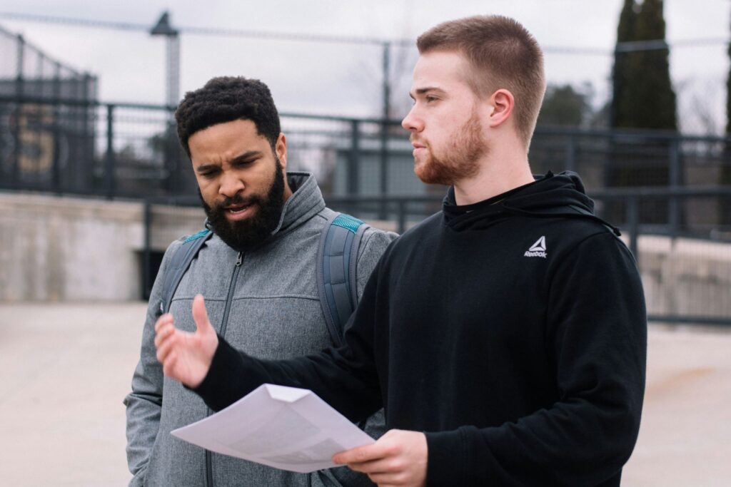 Two people collaborating on a personal goal-setting document during a coaching session.